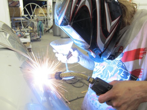 Welding pontoons with a martini by Mayra Cimet